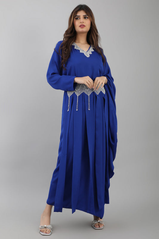 A modern galabiya with a distinctive design, embroidered with beads and indigo colour