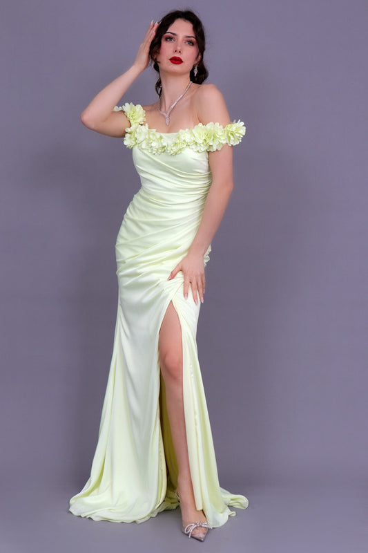 Yellow satin evening dress with pleats and opening