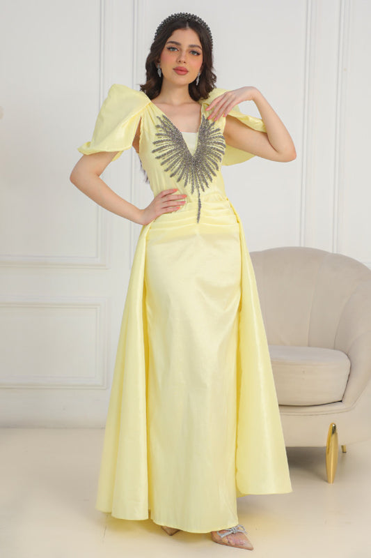 Yellow evening dress with embroidered chest and tail