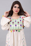 Linen robe embroidered and decorated with colorful tassels 