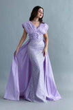 Evening dress embroidered with a mauve train design