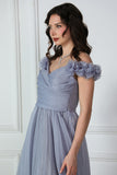 Gray evening dress with ruffle sleeves