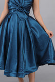 Evening dress with a bow, turquoise