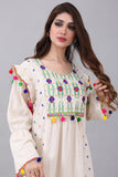 Linen robe embroidered and decorated with colorful tassels 