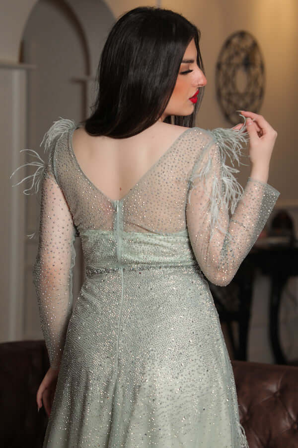 Light green feather-embellished off-shoulder evening dress