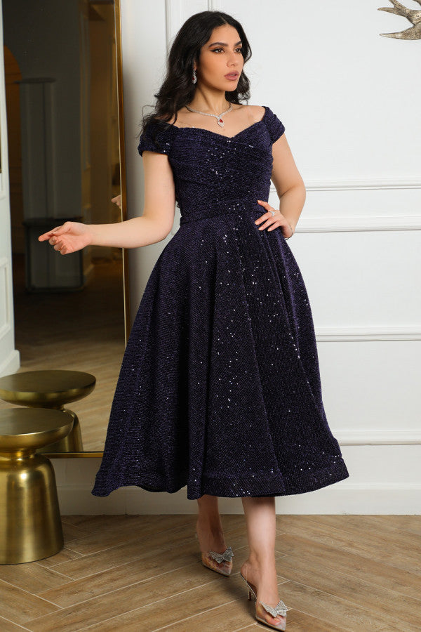 Mid-length evening dress decorated with navy blue sequins