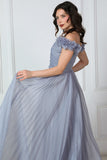 Gray evening dress with ruffle sleeves