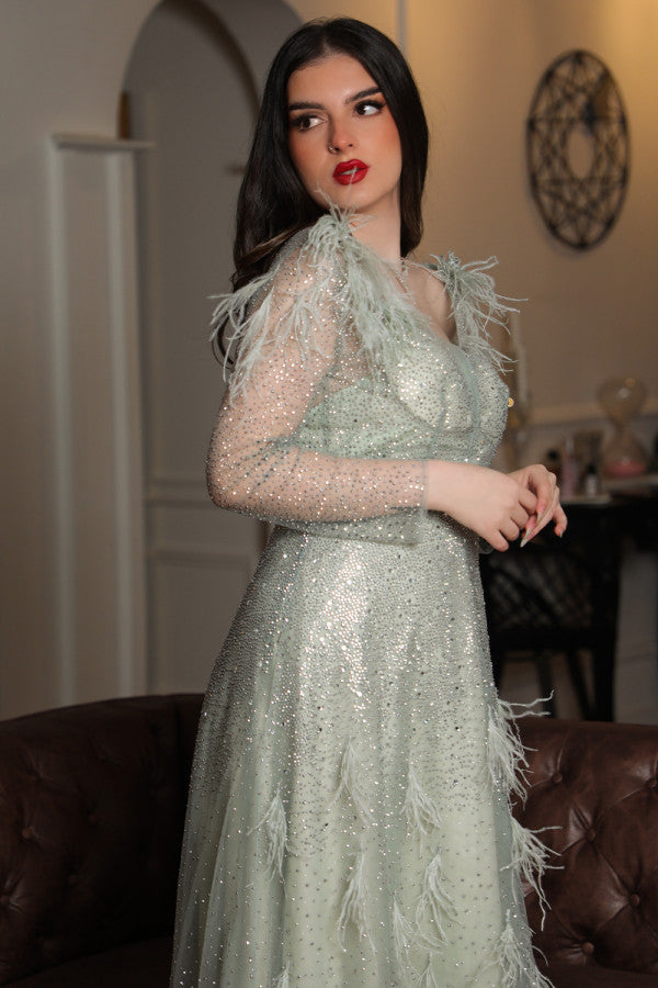 Light green feather-embellished off-shoulder evening dress