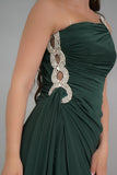 Green one-shoulder jersey evening dress embroidered with crystals