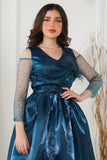 Fluffy evening dress decorated with turquoise beads