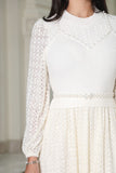 White lace sweater dress with belt at the waist 