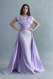 Evening dress embroidered with a mauve train design