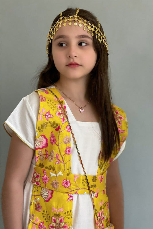 A Kuwaiti girls' jalabiya with a flowing shawl, embroidered and decorated with yellow tassels 