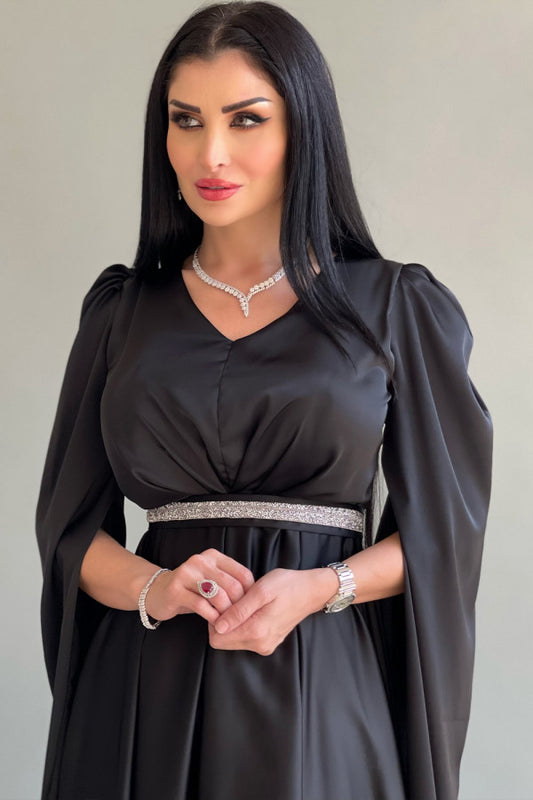 Black asymmetric dress with cape sleeves