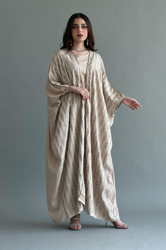 A plain two-piece galabiya with a bisht embroidered with golden threads, beige color