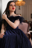 Navy blue evening dress decorated with feathers