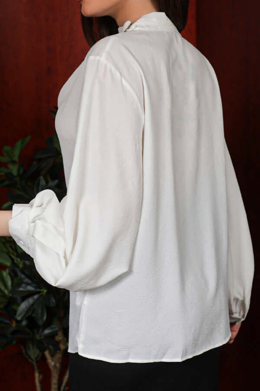 Pleated blouse with a neck belt, off-white color