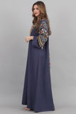 Embroidered oriental galabiya decorated with tassels and navy beads 