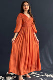 Orange pleated taffeta dress