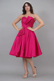 Evening dress with embroidered bodice and pleats, fuchsia color