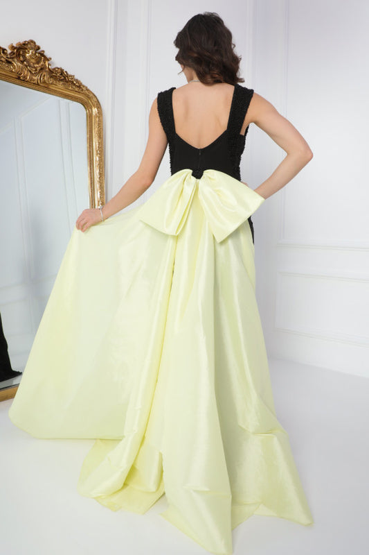 Evening dress with a bow design with a train at the back, yellow color