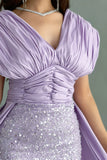 Evening dress embroidered with a mauve train design