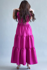 Long dress with layers and a bow on the shoulder, fuchsia color