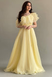 Yellow one-shoulder cloche dress with layers of ruffles