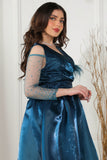 Fluffy evening dress decorated with turquoise beads