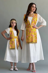 A Kuwaiti girls' jalabiya with a flowing shawl, embroidered and decorated with yellow tassels 