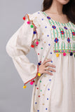 Linen robe embroidered and decorated with colorful tassels 