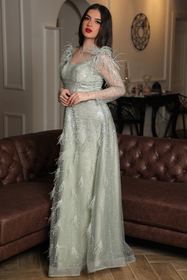 Light green feather-embellished off-shoulder evening dress