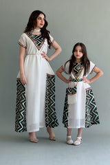 Kuwaiti girls' jalabiya with embroidered sides, sugar color with dark green