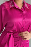 Pleated shirt dress decorated with crystals and feathers in fuchsia