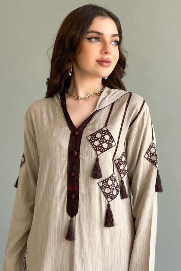 Beige embroidered kaftan with tassels