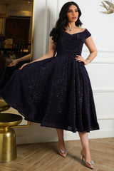 Mid-length evening dress decorated with navy blue sequins