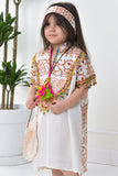 Girls' linen robe with green patterns on the back, decorated with brick-coloured tassels 