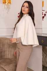 Elegant winter shawl with a white brooch 