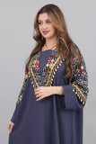 Embroidered oriental galabiya decorated with tassels and navy beads 