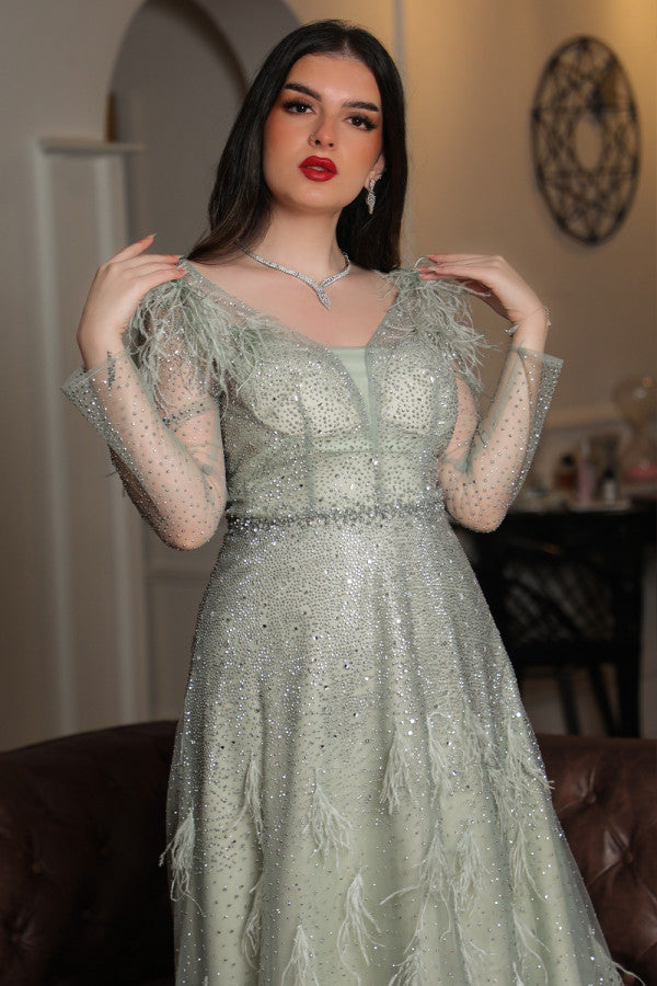 Light green feather-embellished off-shoulder evening dress