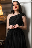 Evening dress with a pleated design on the chest, one shoulder, black color