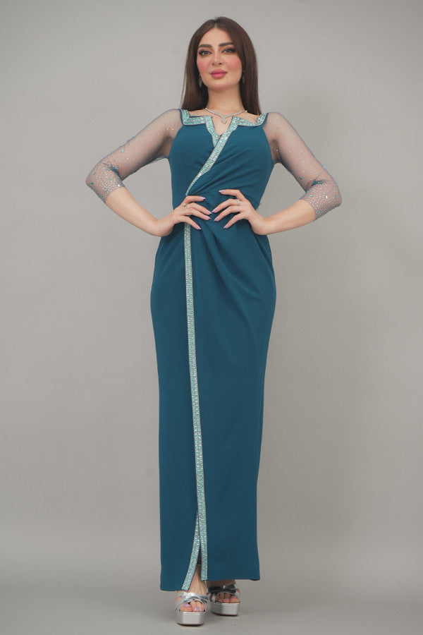 Maxi dress with tulle sleeves decorated with a turquoise crystal ribbon