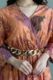 Floral dress with gold chain belt, orange color