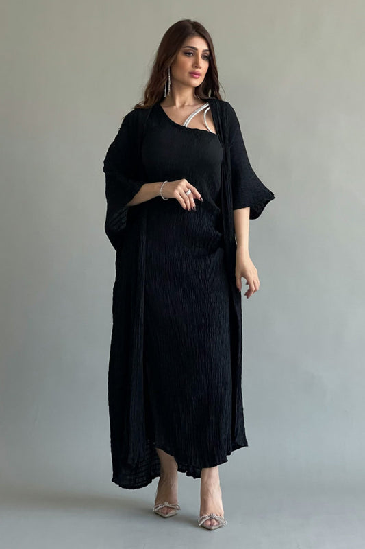 An elegant two-piece jalabiya with modern details, black color