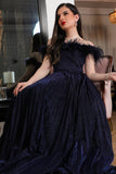 Navy blue evening dress decorated with feathers