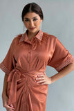 Pleated shirt dress decorated with crystals and orange feathers