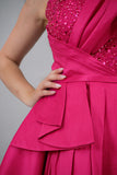 Evening dress with embroidered bodice and pleats, fuchsia color