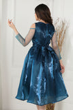 Fluffy evening dress decorated with turquoise beads