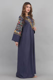 Embroidered oriental galabiya decorated with tassels and navy beads 