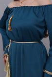 A soft oriental robe with ruffles sleeves decorated with golden crystals, turquoise colour